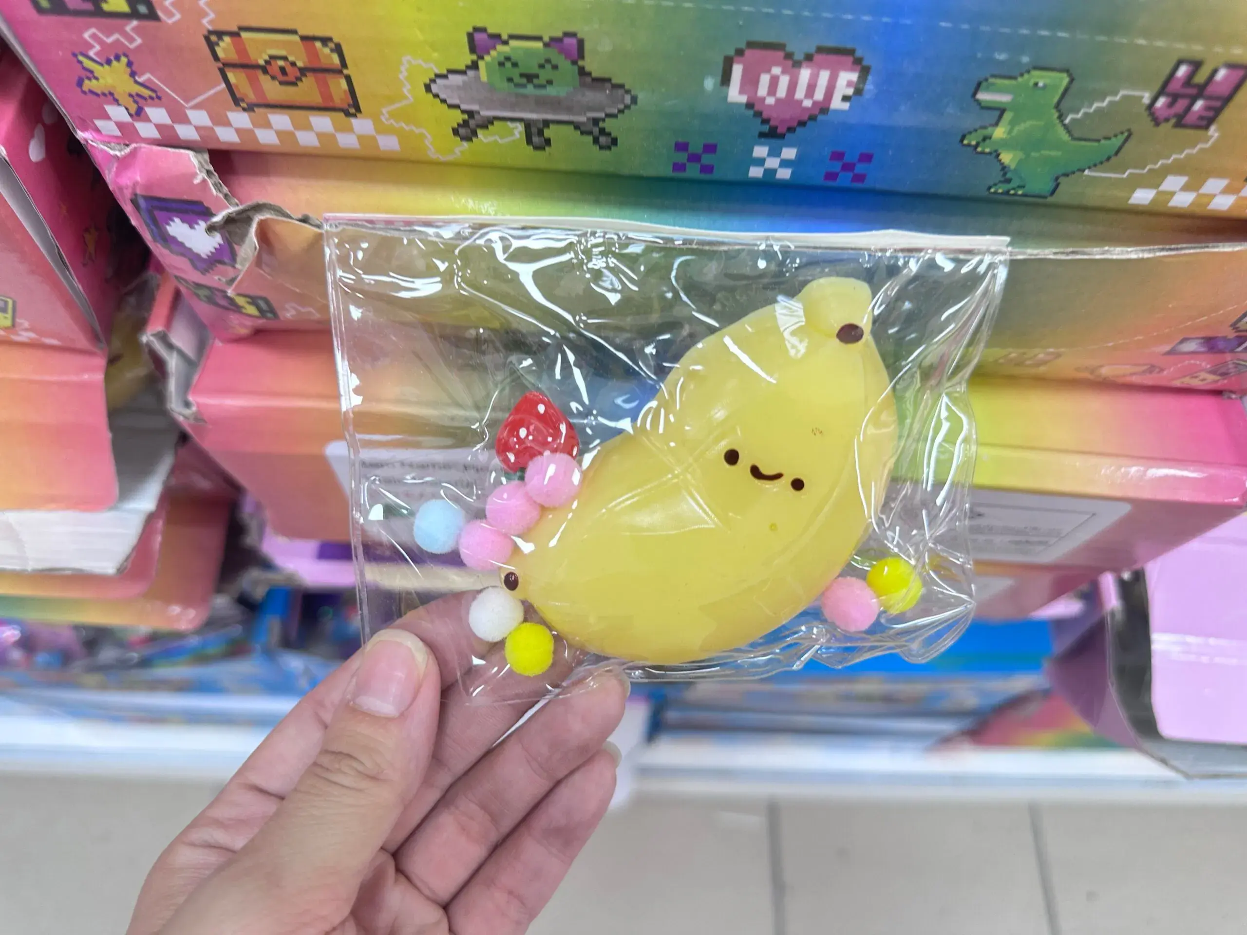 Zabawki Squeeze Toys Gniotek Banan z Pomponami 16 szt