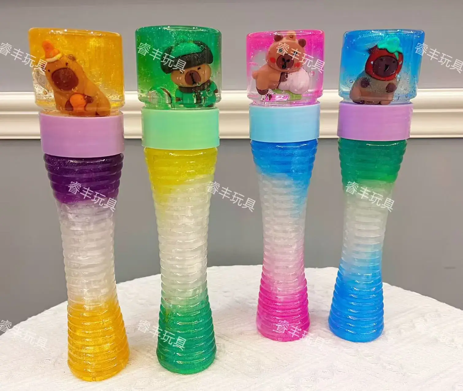 Zabawki Slime Kapibara w tubie z figurką, brokatowy, 12 szt.