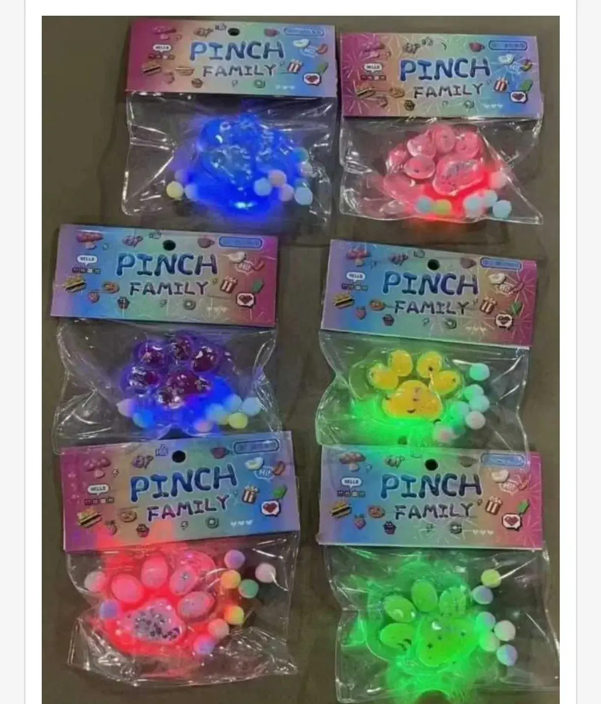 Zabawki Pinch Family Gniotek Łapka LED z Brokatem 16 szt.